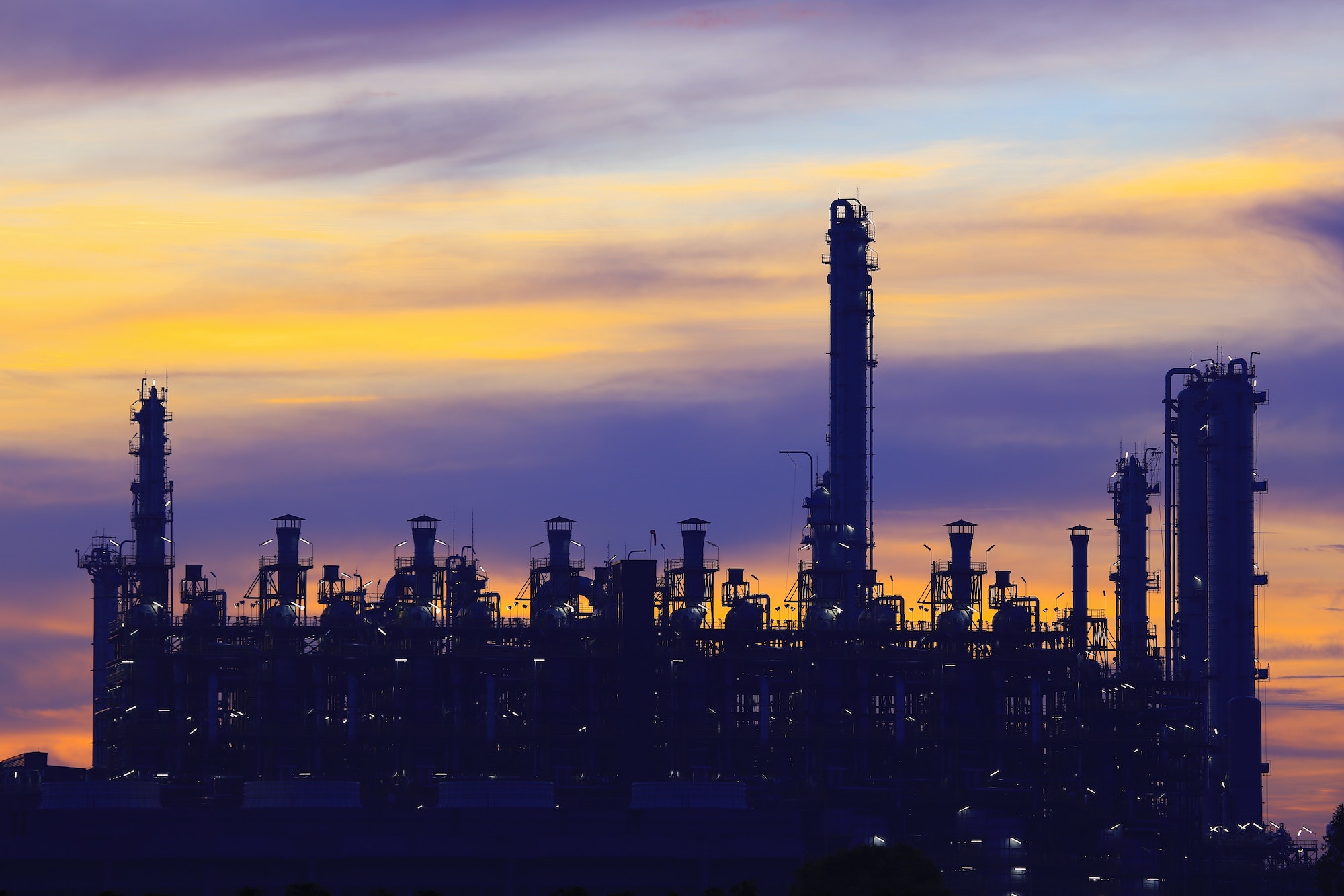 Construction of pipeline of oil refinery power plant at dusk time